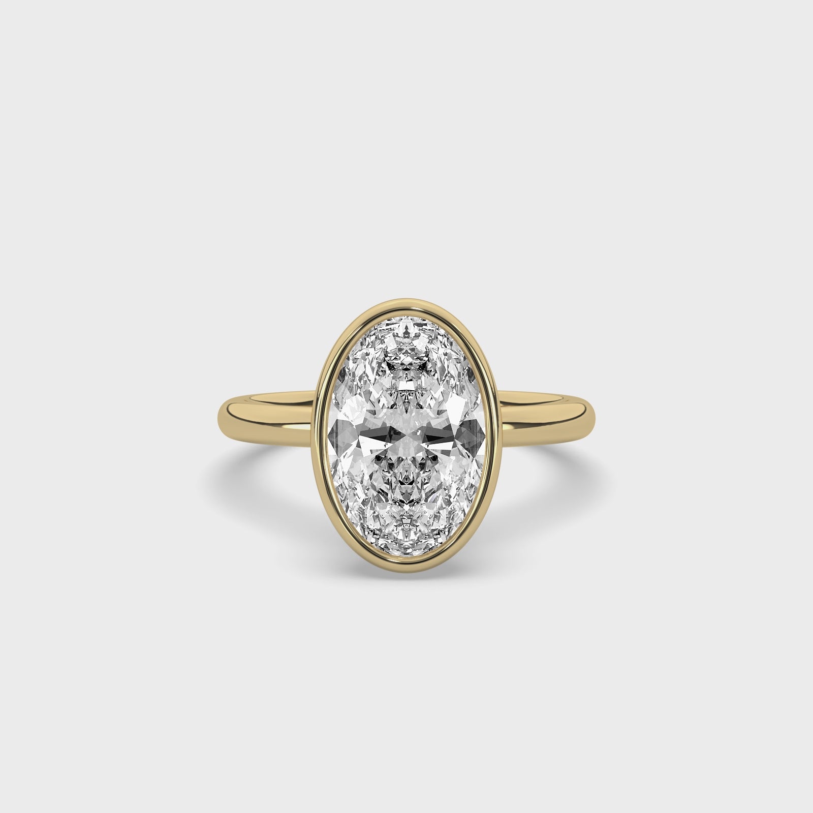 product video of ALVA Bezel Oval Diamond Solitaire Ring in yellow gold in a white background
