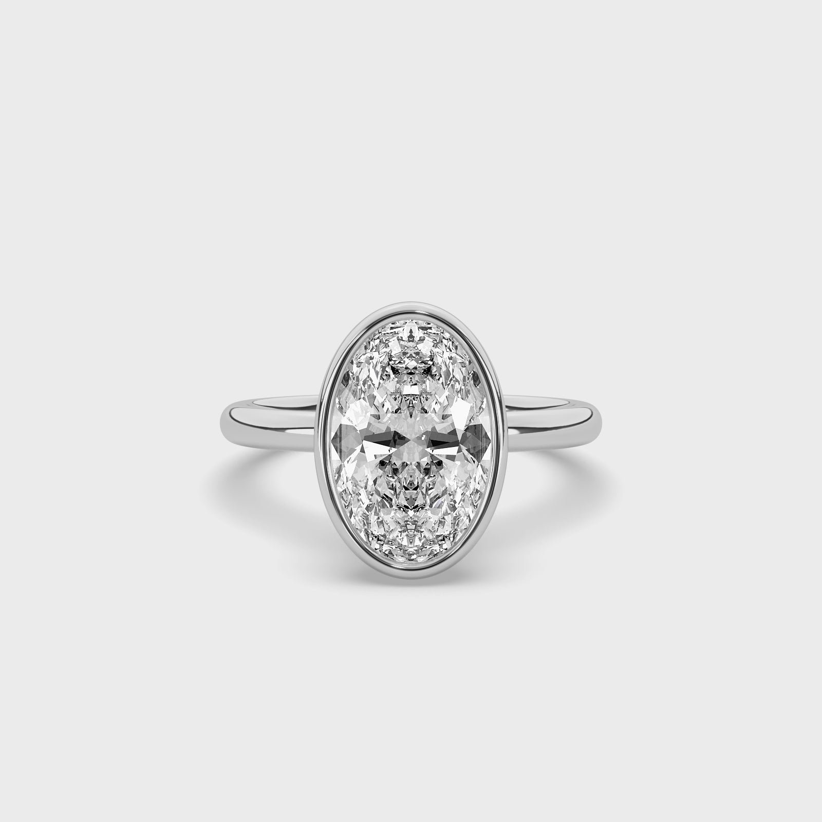 product video of ALVA Bezel Oval Diamond Solitaire Ring in white gold in a white background